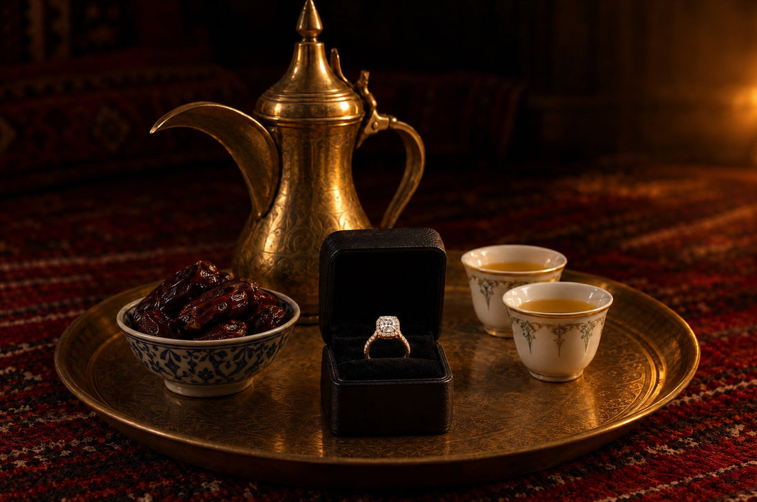 An open ring box with a cushion-cut halo diamond ring on a brass tray, beside an Arabic coffee pot, two cups of qahwa and a bowl of dates
