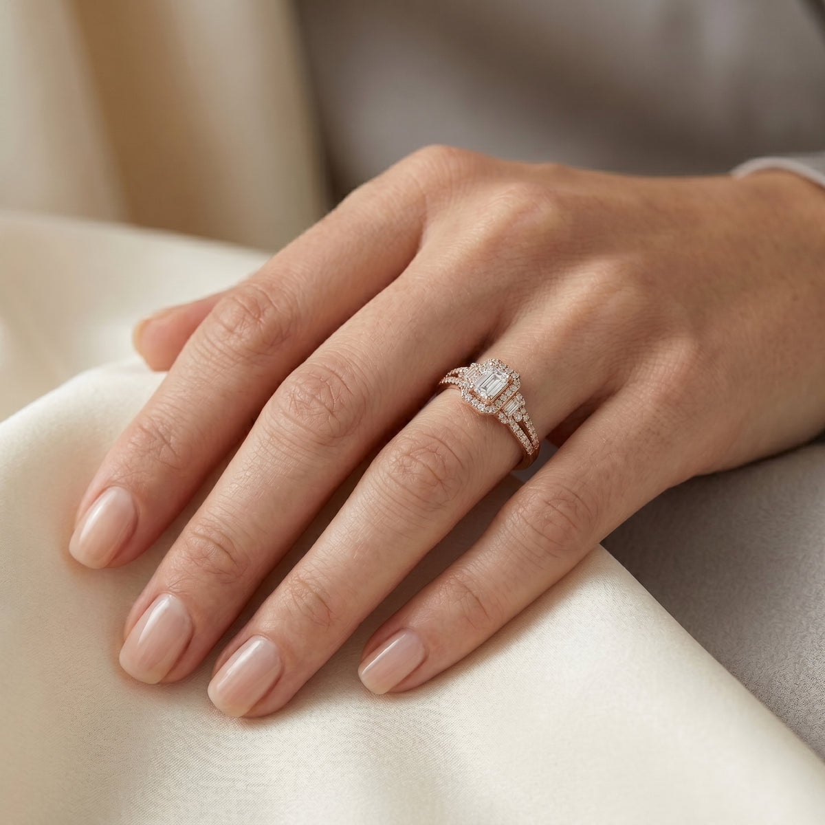 Emerald Cut Three Stone Halo Engagement Ring with Baguette Sides and Pavé Band — lifestyle