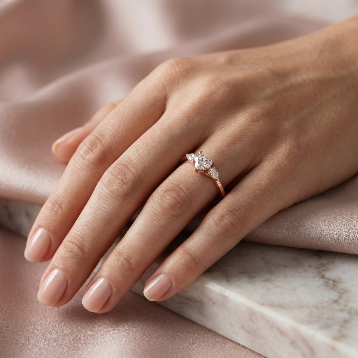 Heart Cut Three Stone Engagement Ring with Pear Sides — lifestyle