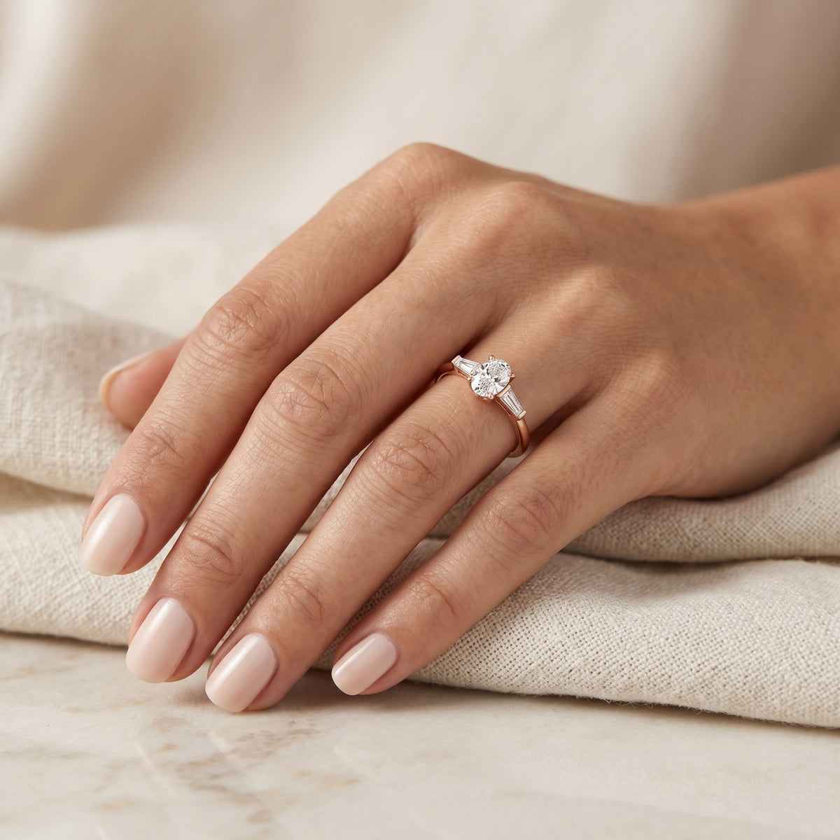 Oval Diamond Three Stone Engagement Ring with Tapered Baguette Sides — lifestyle