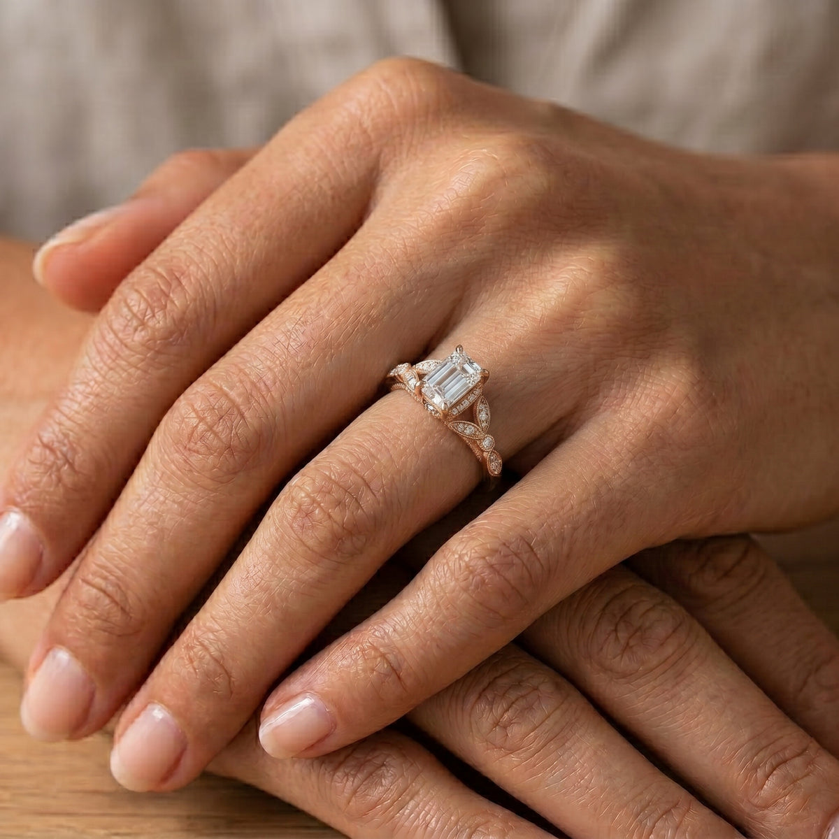 Emerald Cut Engagement Ring with Sculpted Leaf Side Accents — lifestyle