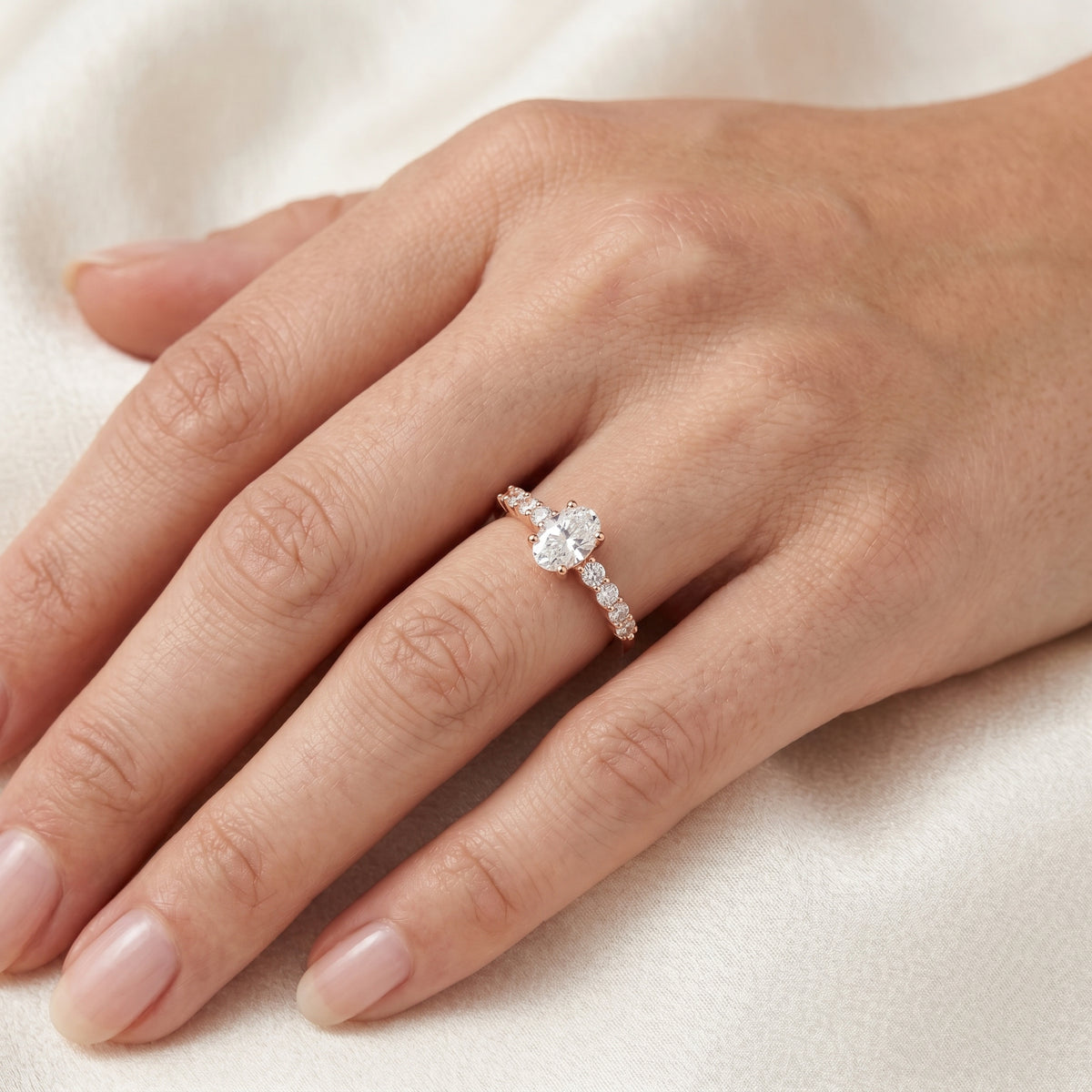 Oval Diamond Engagement Ring with Round Side Accents — lifestyle