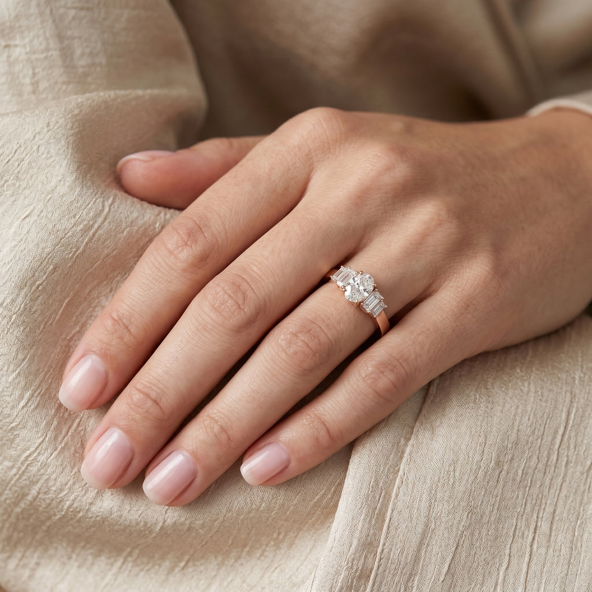 Oval Diamond Engagement Ring with Tapered Baguette Side Accents and Knife Edge Band