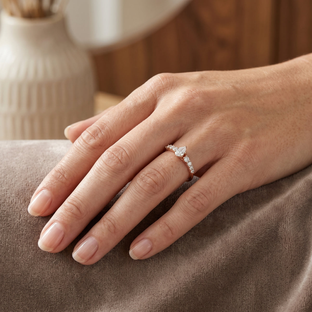 Pear Diamond Engagement Ring with Graduated Round Side Accents — lifestyle