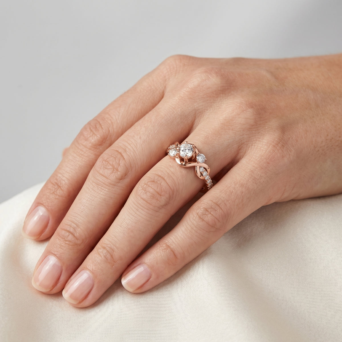 Round Diamond Engagement Ring with Round Side Accents and Pavé Bow Shank — lifestyle