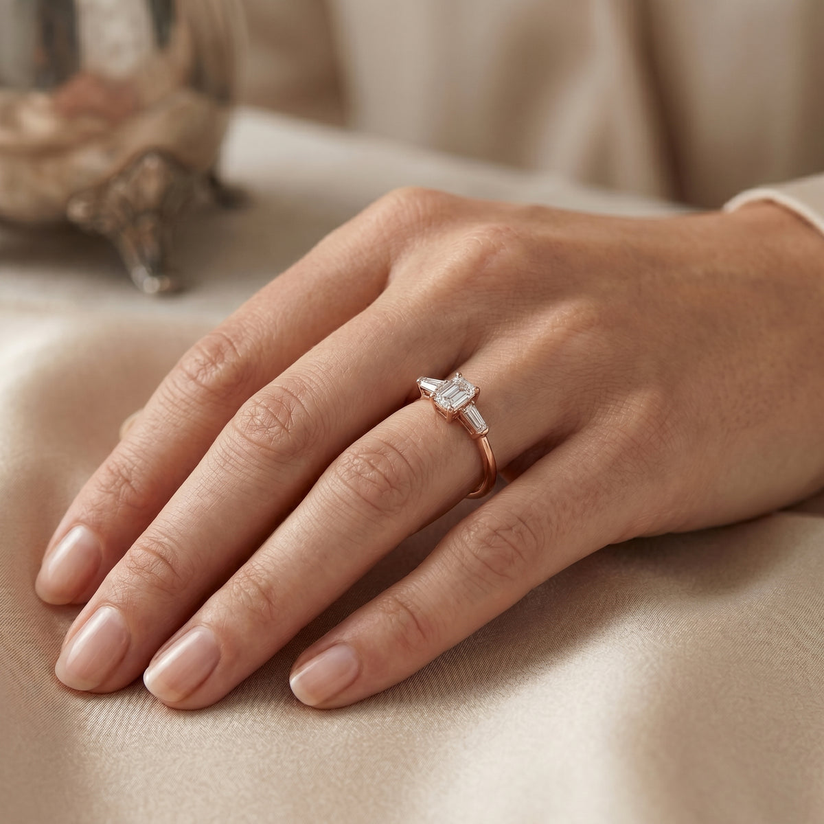Emerald Cut Three Stone Engagement Ring with Tapered Baguette Sides — lifestyle