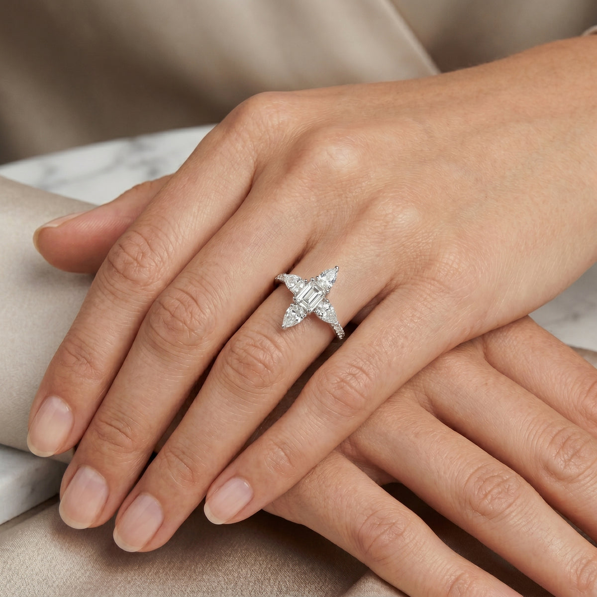 Emerald and Pear Vertical Three Stone Engagement Ring with Pavé Band