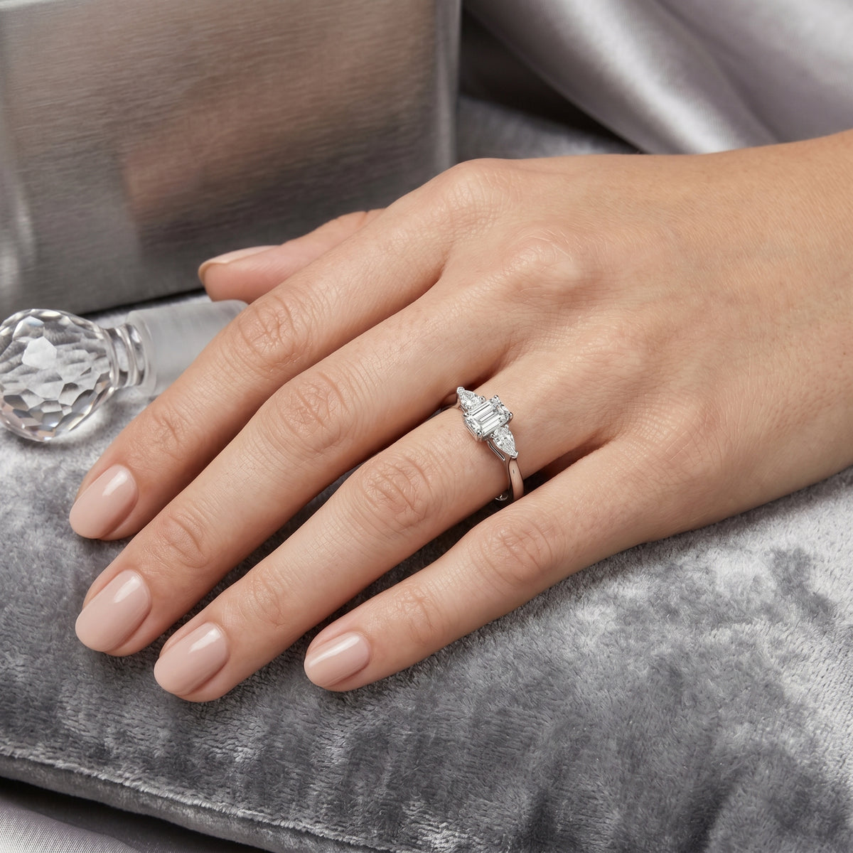 Emerald Cut Three Stone Engagement Ring with Pear Sides — lifestyle