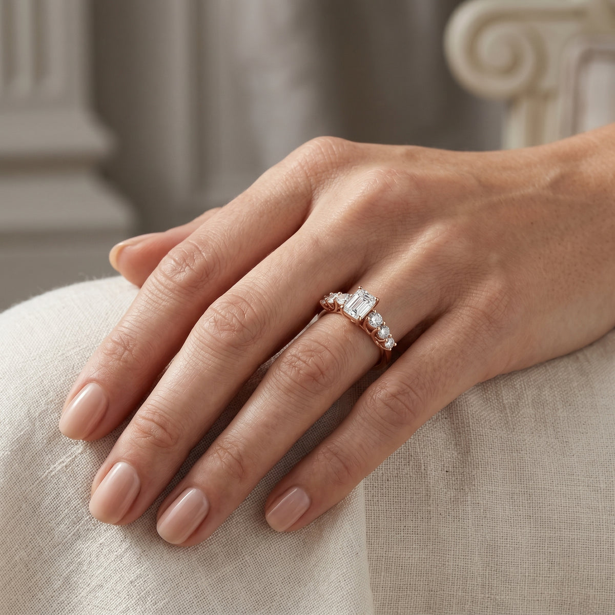 Emerald Cut Engagement Ring with Round Side Accents on Chevron Shoulders — lifestyle