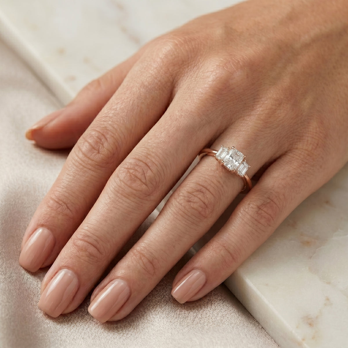 Radiant Cut Three Stone Engagement Ring with Trapezoid Side Stones — lifestyle