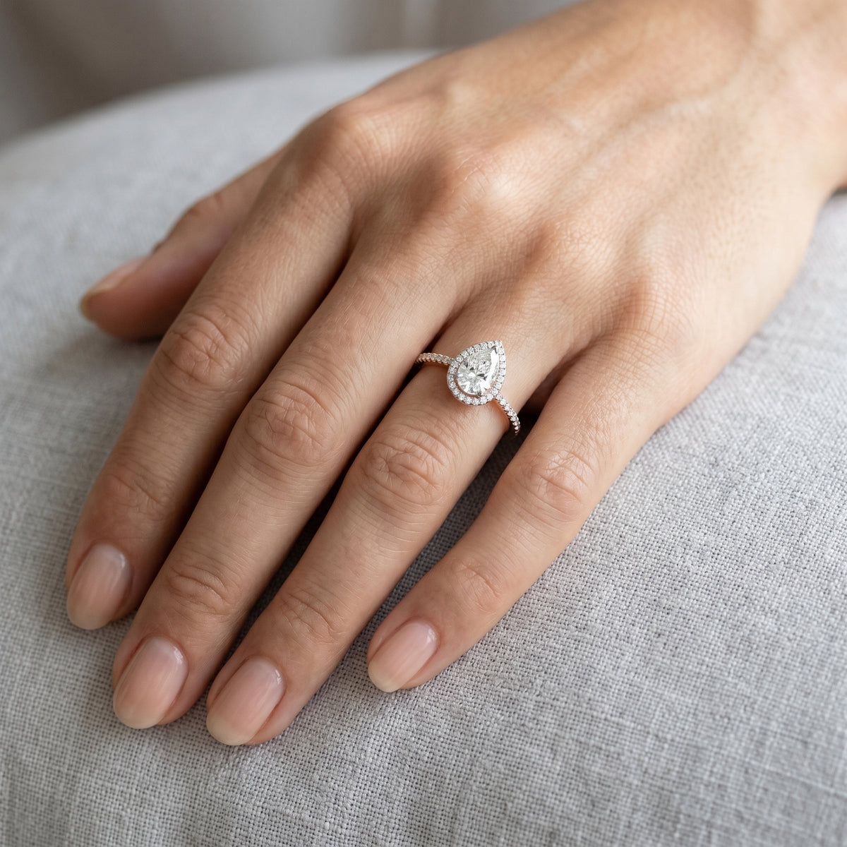 Pear Diamond Halo Engagement Ring with Pavé Band — lifestyle