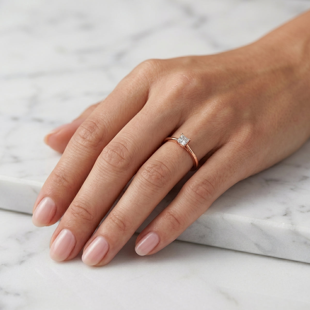 Cushion Cut Tapered Solitaire Engagement Ring — lifestyle