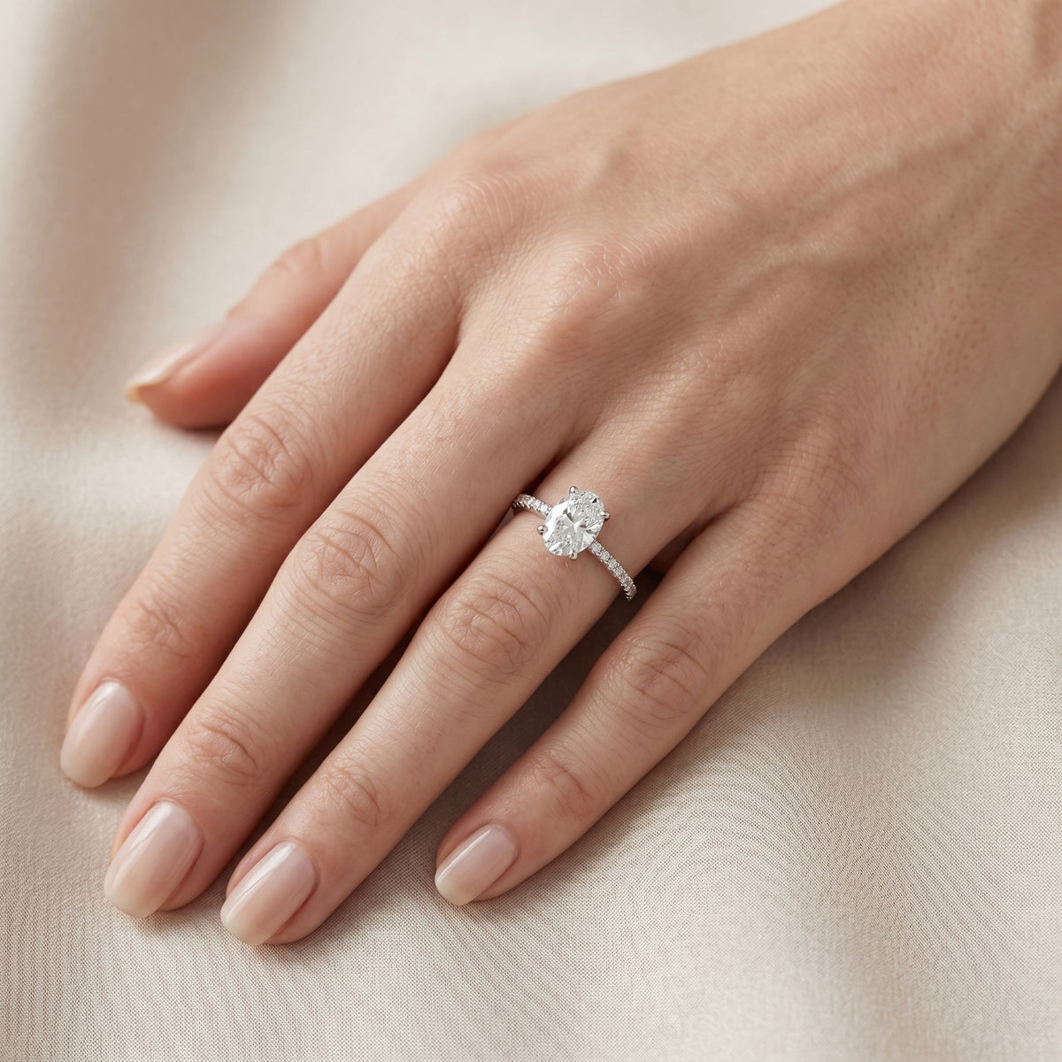 Oval Diamond Hidden Halo Engagement Ring with Pavé Band — lifestyle