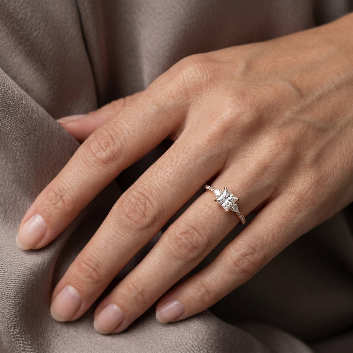 Princess Cut Engagement Ring with Trilliant Side Accents and Pavé Band — lifestyle