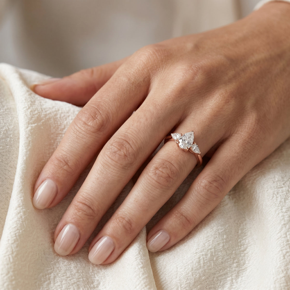 Pear Diamond Three Stone Engagement Ring with Pear Sides — lifestyle