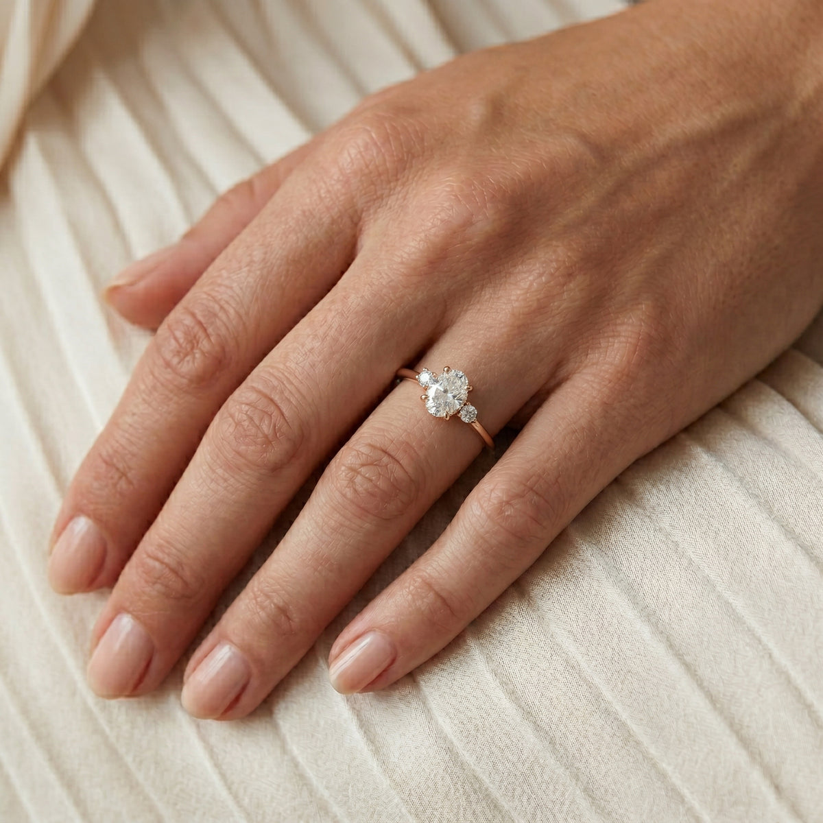 Oval Diamond Engagement Ring with Round Side Accents — lifestyle
