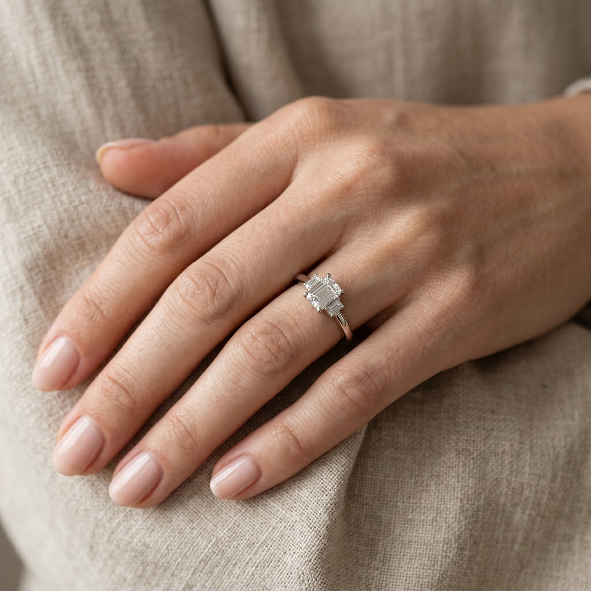 Emerald Cut Three Stone Engagement Ring — lifestyle