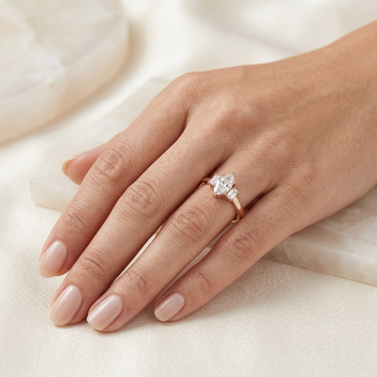 Marquise Cut Three Stone Engagement Ring with Emerald Sides — lifestyle