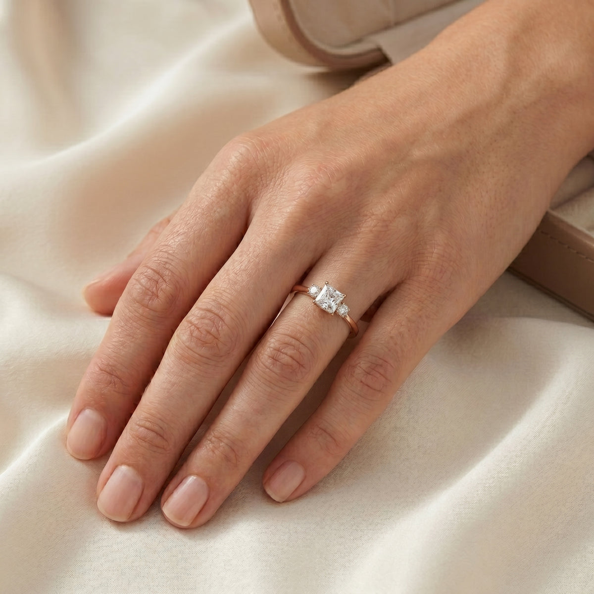 Asscher Cut Three Stone Engagement Ring with Round Sides — lifestyle