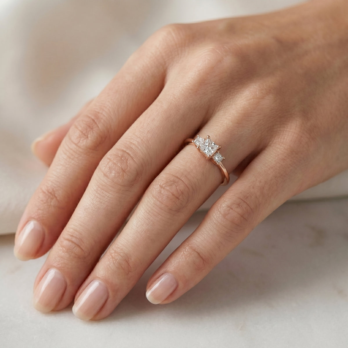 Princess Cut Three Stone Engagement Ring with Round Sides — lifestyle