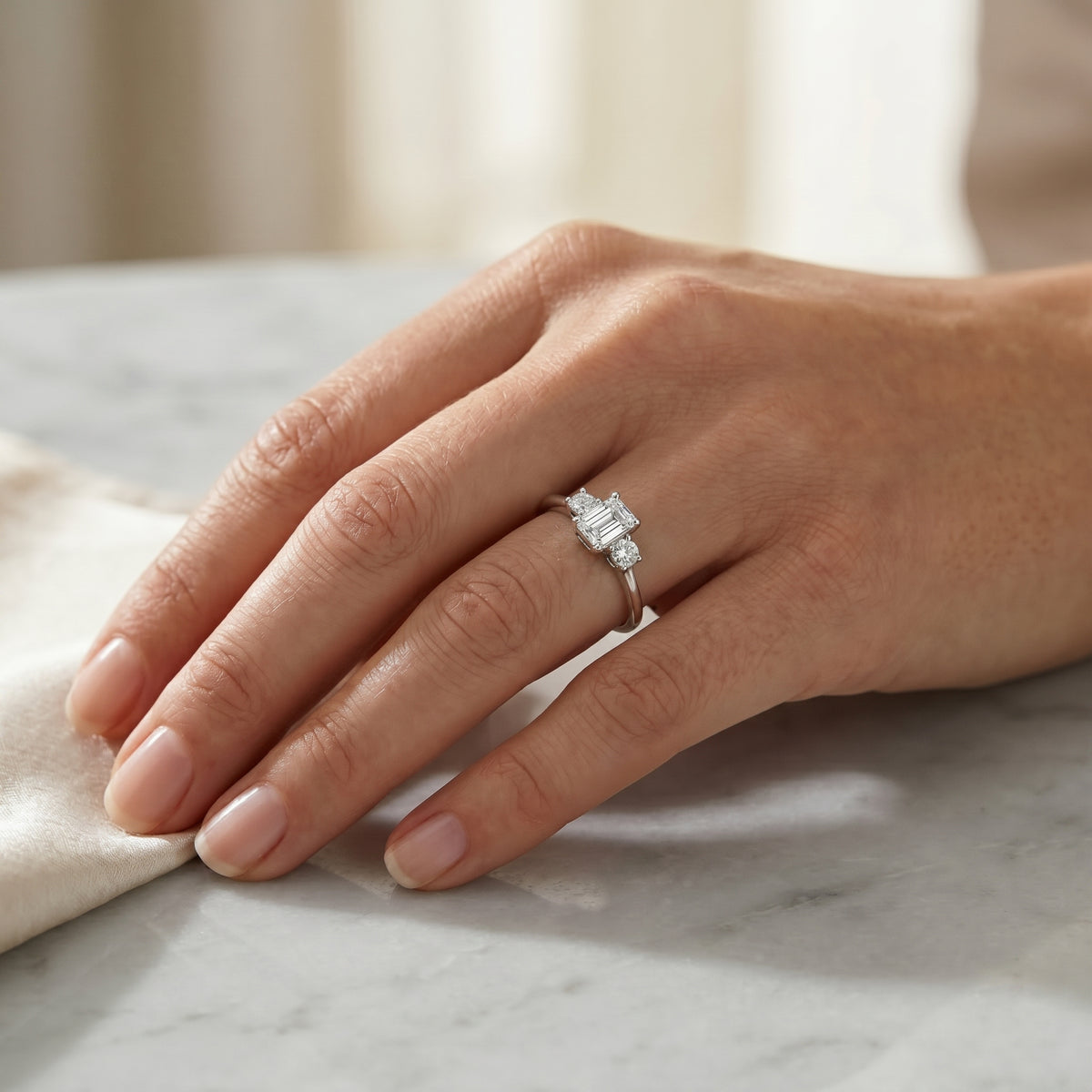 Radiant Cut Three Stone Engagement Ring with Round Sides — lifestyle