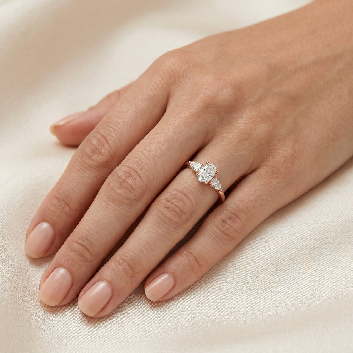 Oval Diamond Engagement Ring with Marquise and Round Side Accents — lifestyle