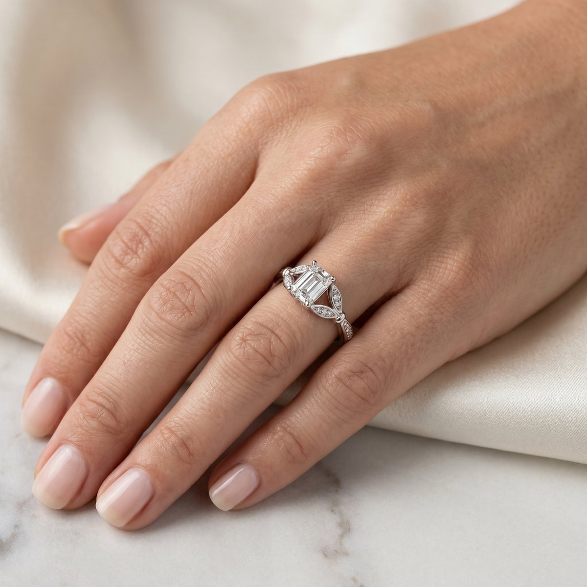 Emerald Cut Engagement Ring with Leaf Side Accents and Pavé Band — lifestyle