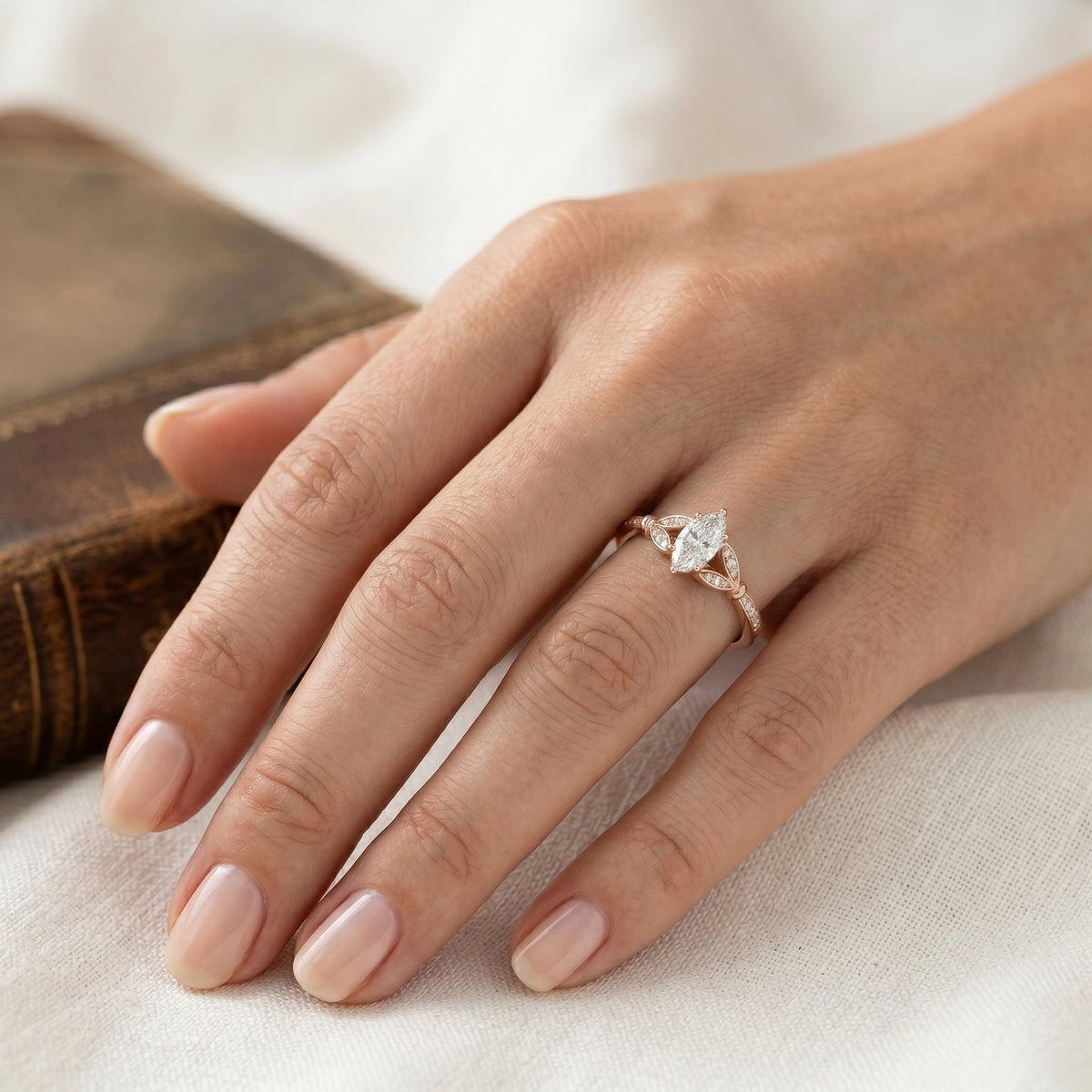 Marquise Cut Engagement Ring with Leaf Accents and Pavé Band — lifestyle
