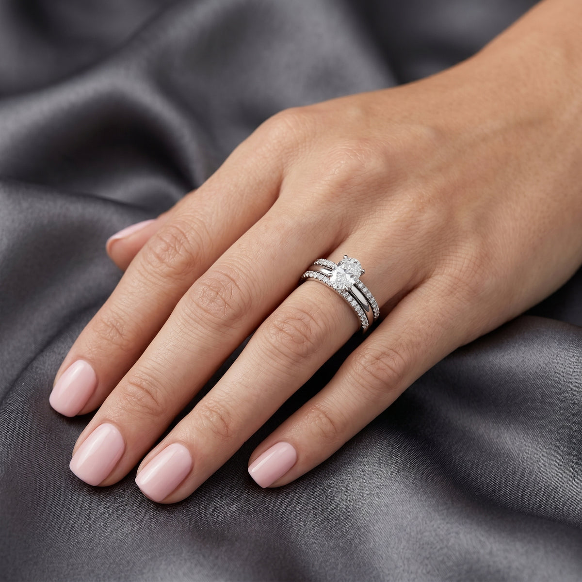 Oval Diamond Engagement Ring with Triple Stacked Pavé Band — lifestyle