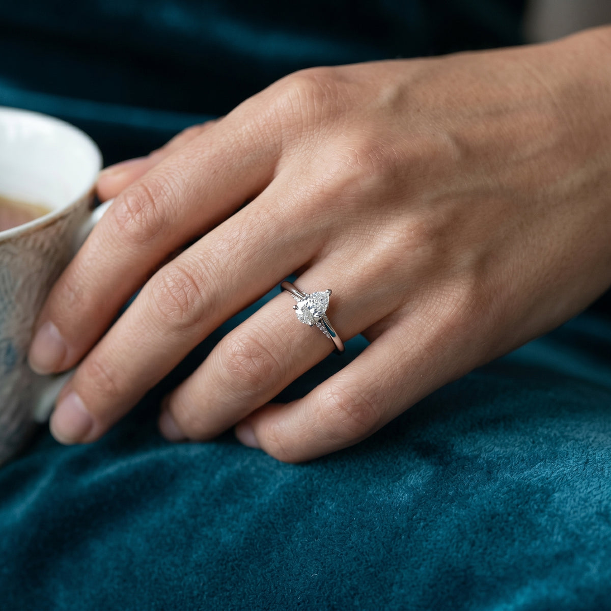 Pear Diamond Engagement Ring with Pavé Side Accents on Twisted Shank — lifestyle