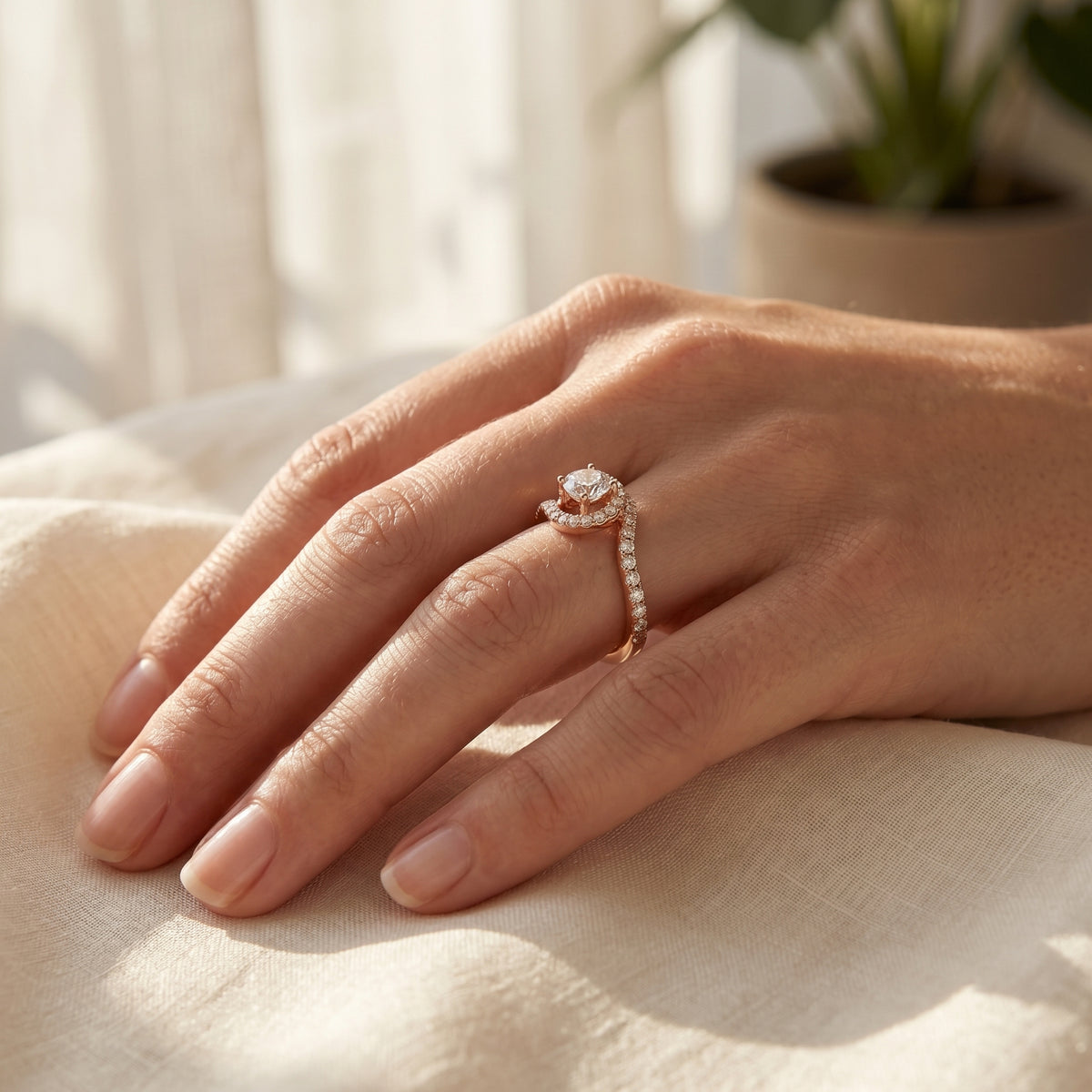 Round Diamond Halo Engagement Ring with Bypass Pavé Shank — lifestyle