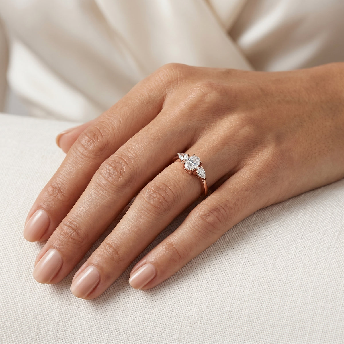 Oval Diamond Three Stone Engagement Ring with Pear Sides — lifestyle