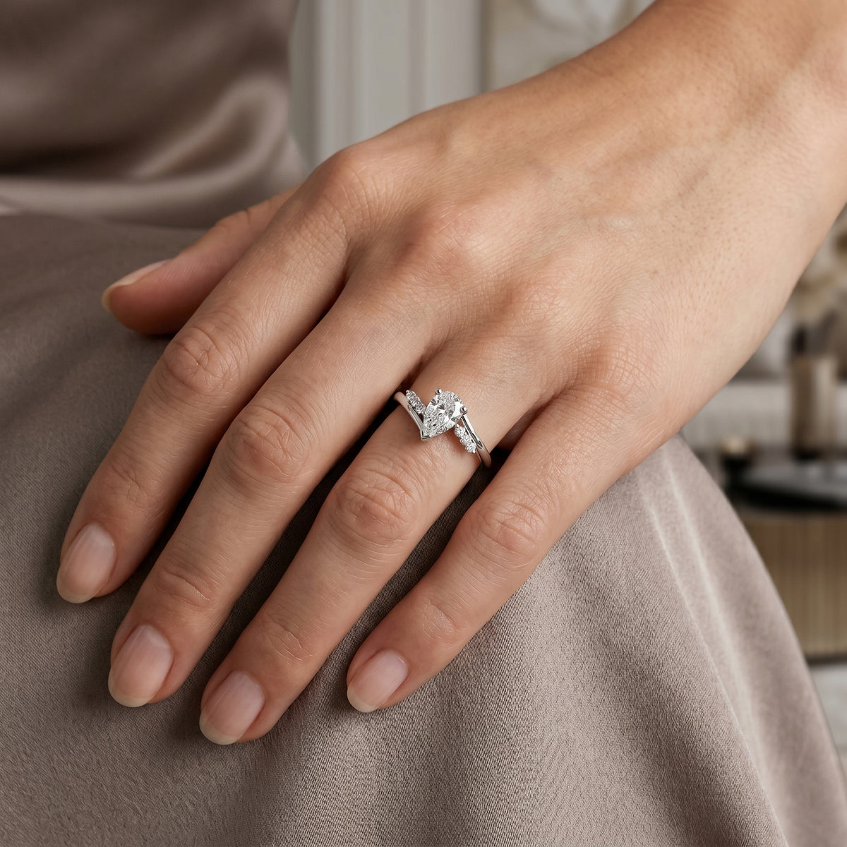 Pear Diamond Halo Engagement Ring with Round Side Accents — lifestyle