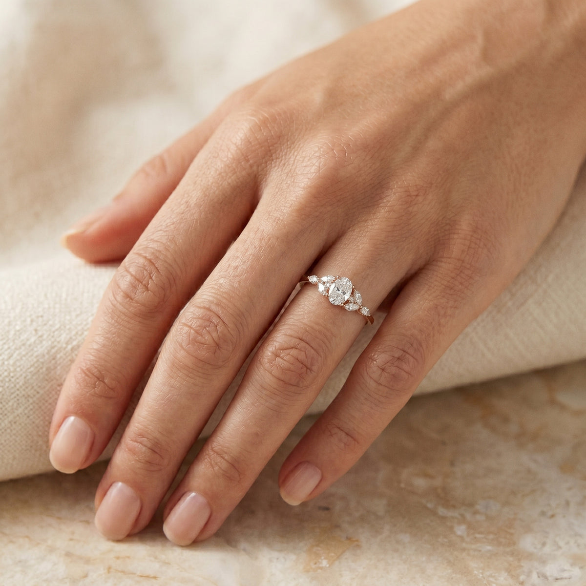 Oval Diamond Engagement Ring with Marquise Sides and Round Accents
