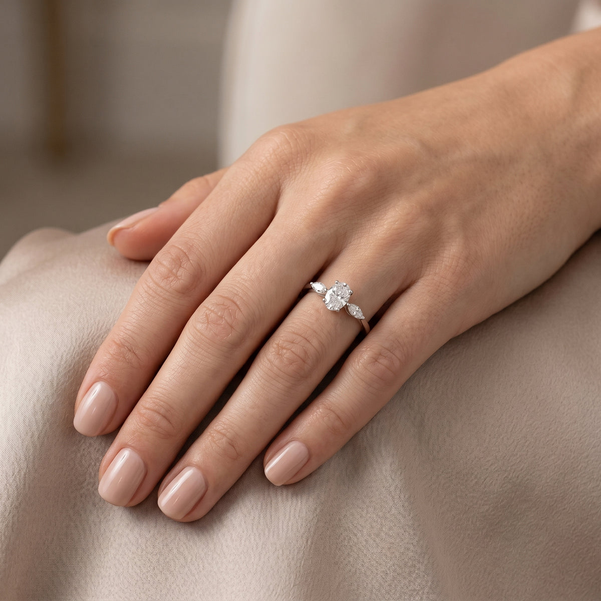 Oval Diamond Three Stone Engagement Ring with Marquise Sides — lifestyle
