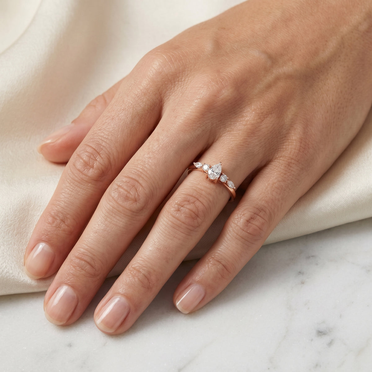 Pear with Mixed Shaped Sidestones Diamond Ring — lifestyle