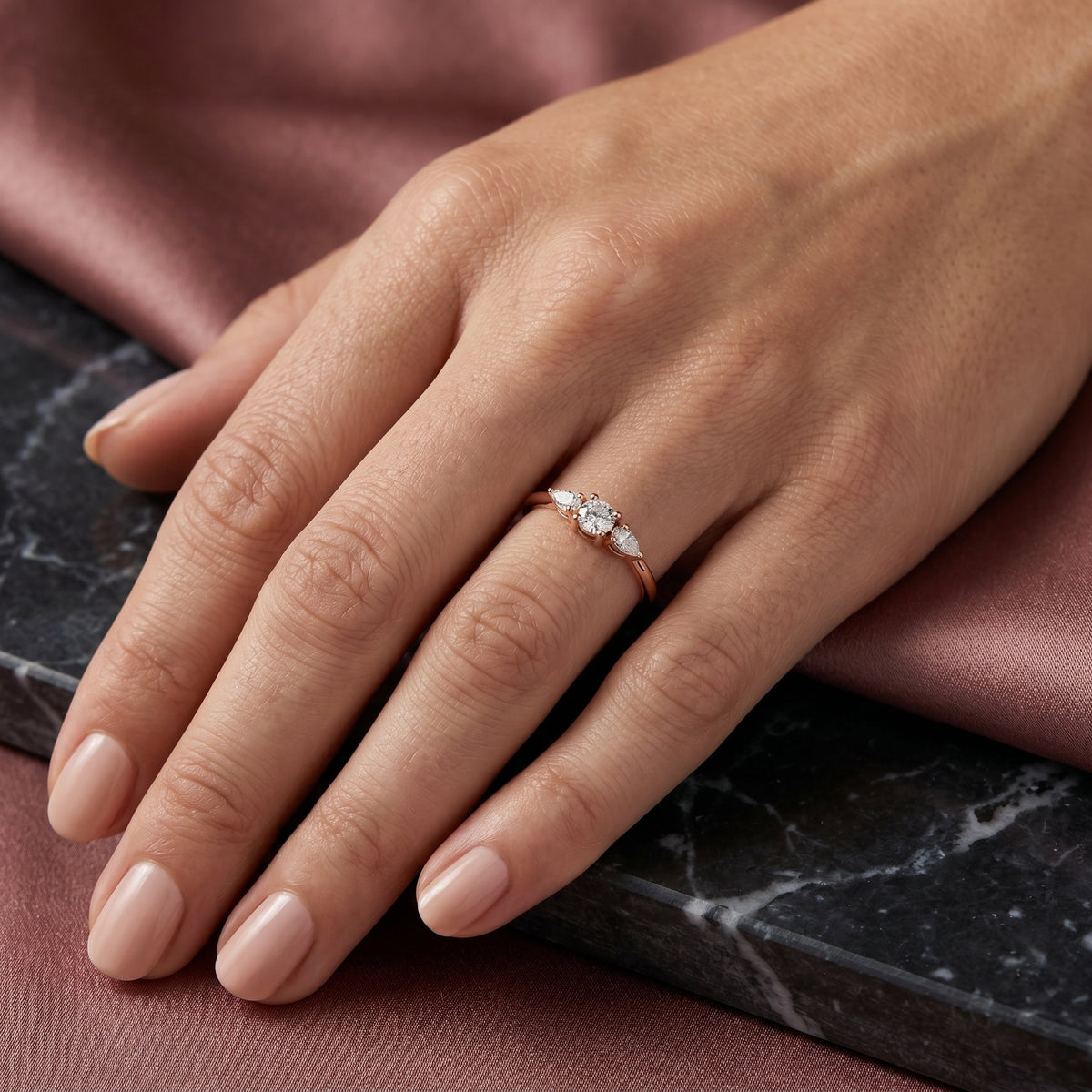 Round Diamond Three Stone Engagement Ring with Pear Sides — lifestyle