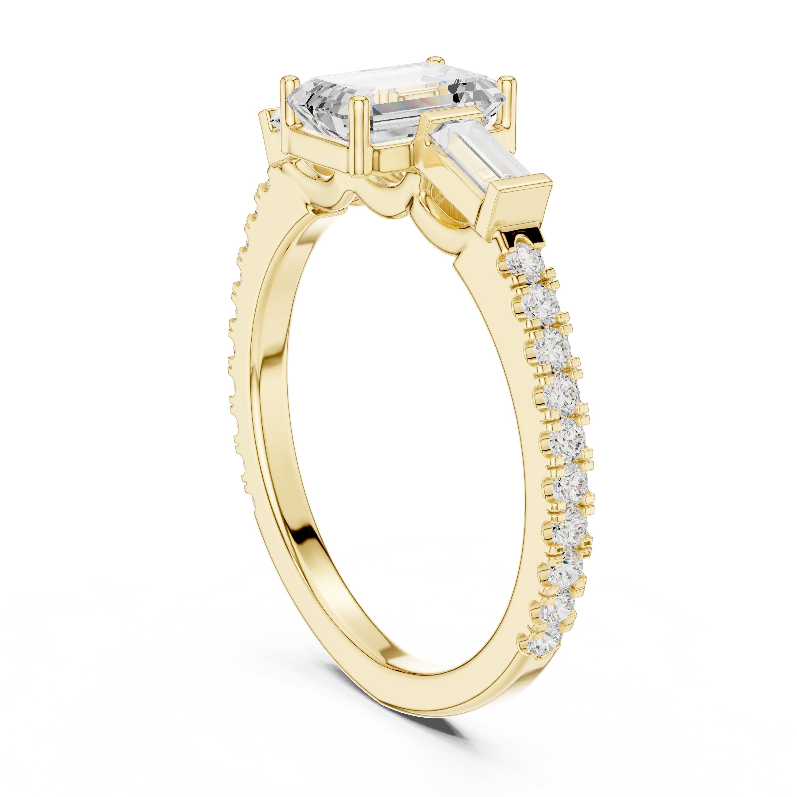 Emerald Cut Three Stone Engagement Ring with Baguette Sides and Pavé Band in Yellow Gold - VYKA Diamonds