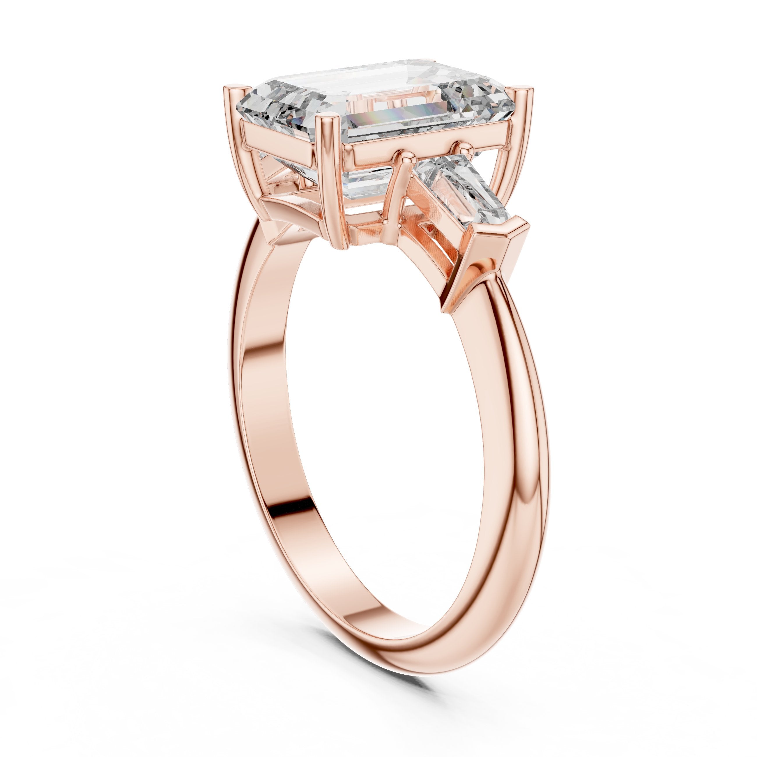 Emerald Cut Three Stone Engagement Ring with Tapered Baguette Sides in Rose Gold - VYKA Diamonds