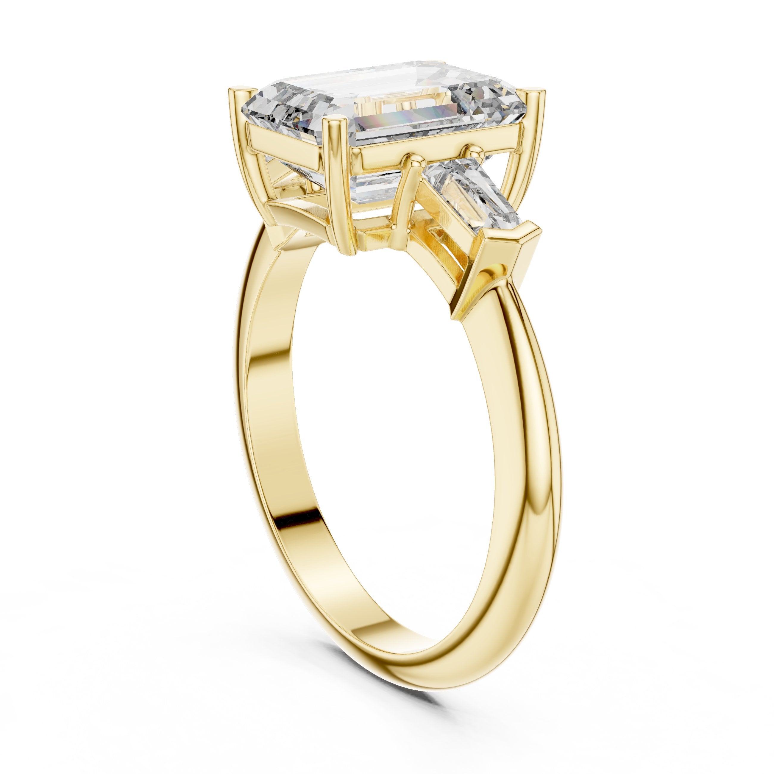 Emerald Cut Three Stone Engagement Ring with Tapered Baguette Sides in Yellow Gold - VYKA Diamonds