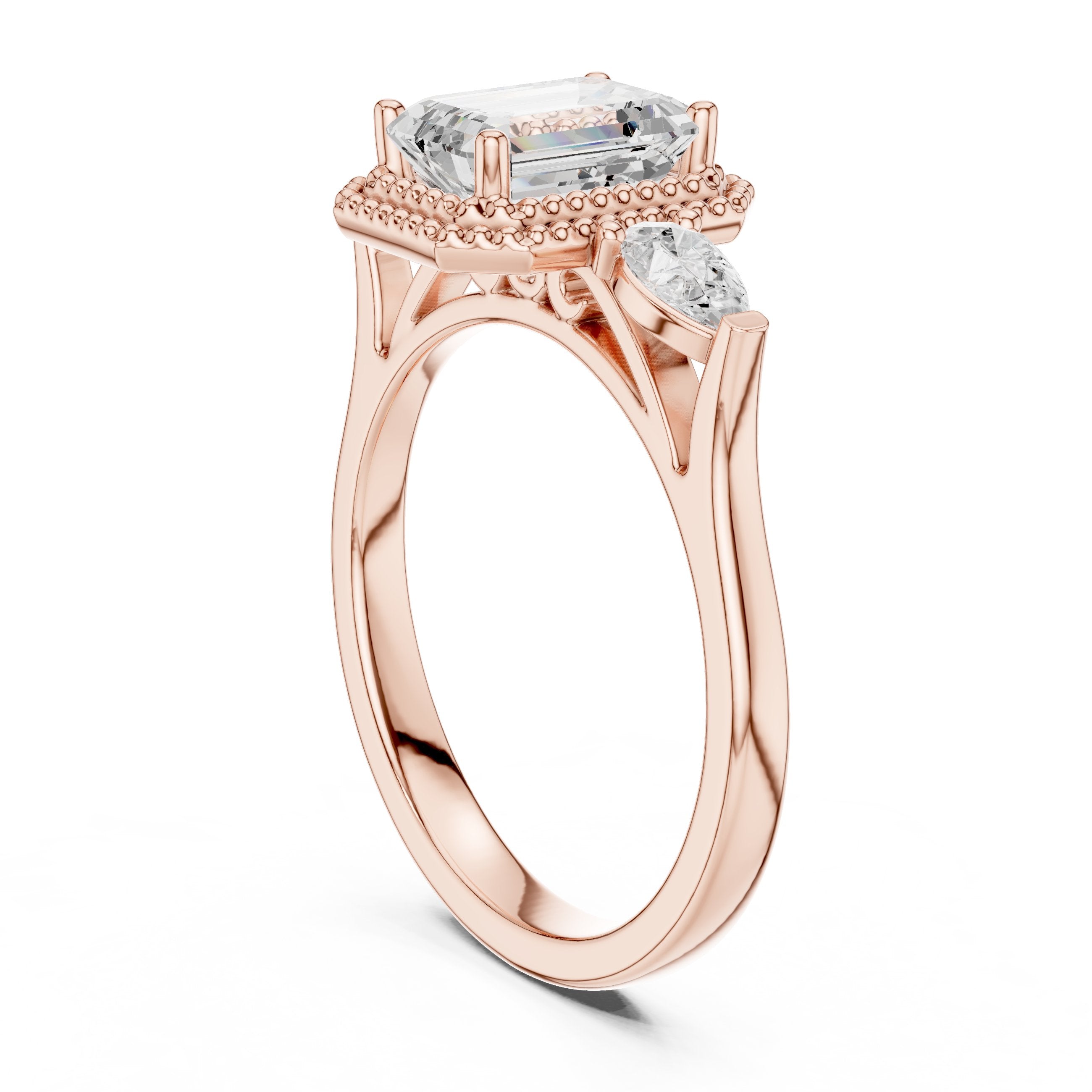 Emerald Cut Three Stone Halo Engagement Ring with Pear Sides in Rose Gold - VYKA Diamonds