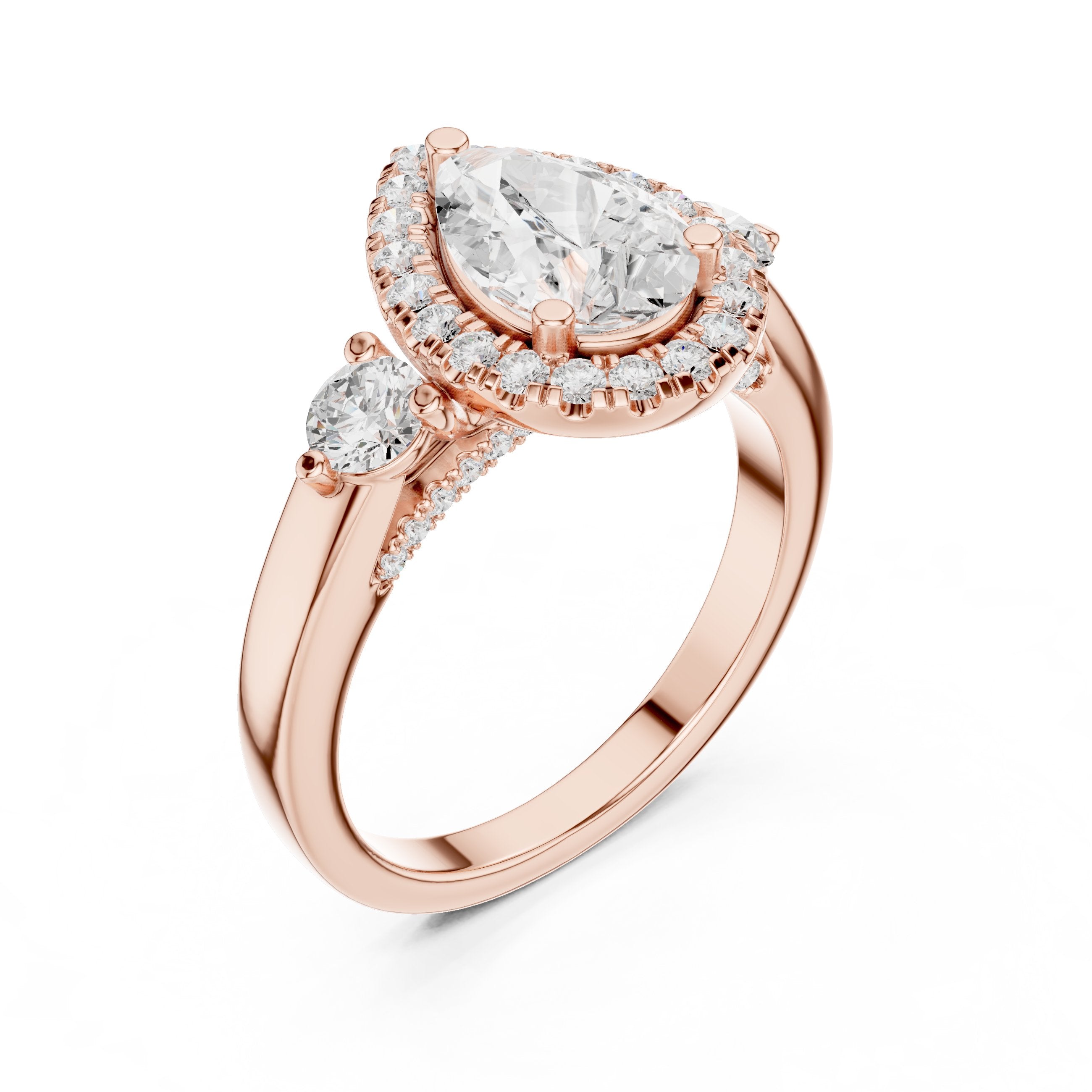 Pear Diamond Three Stone Halo Engagement Ring with Round Side Stones in Rose Gold - VYKA Diamonds