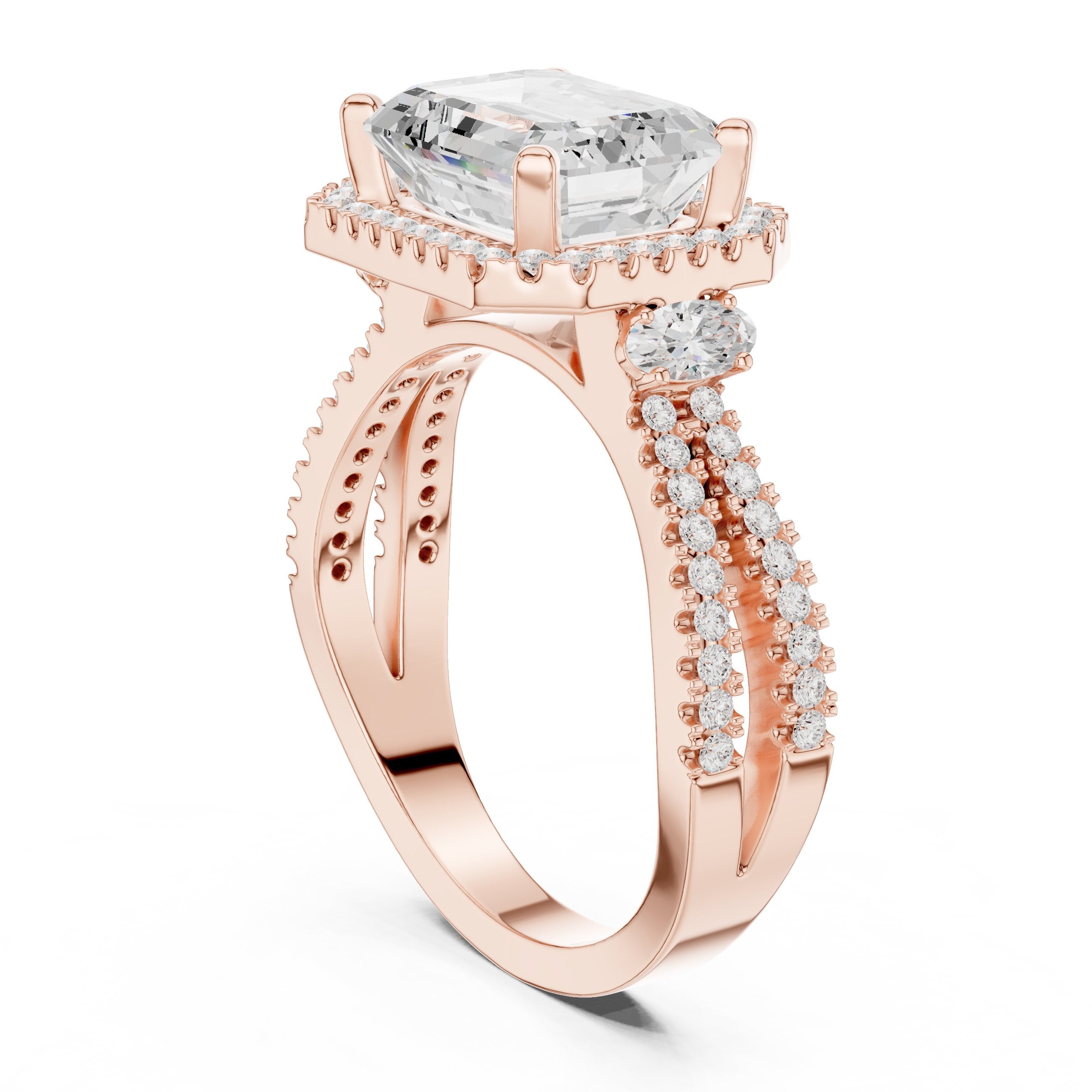 Emerald Cut Three Stone Halo Engagement Ring with Oval Sides and Split Shank Pavé Band in Rose Gold - VYKA Diamonds