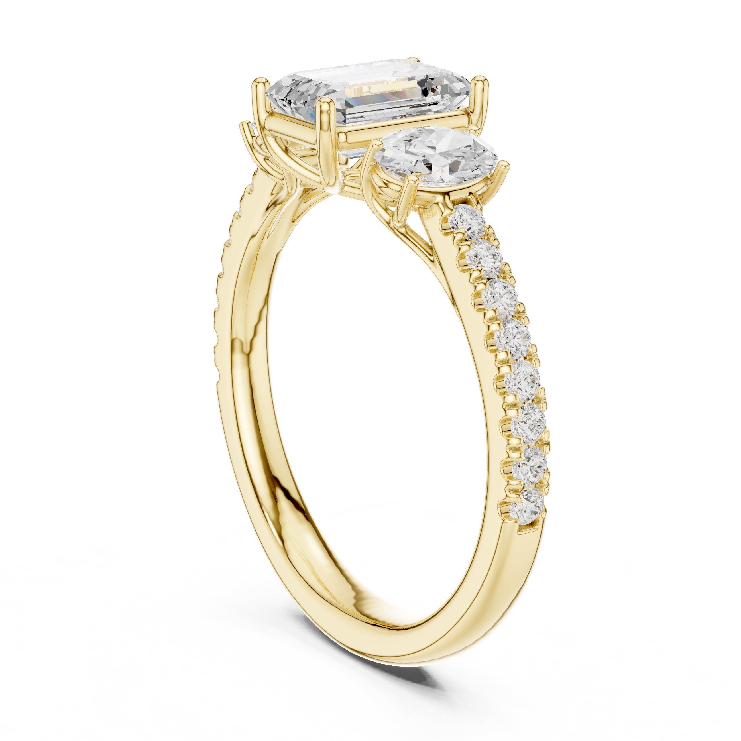 Emerald Cut Three Stone Engagement Ring with Oval Sides and Pavé Band in Yellow Gold - VYKA Diamonds