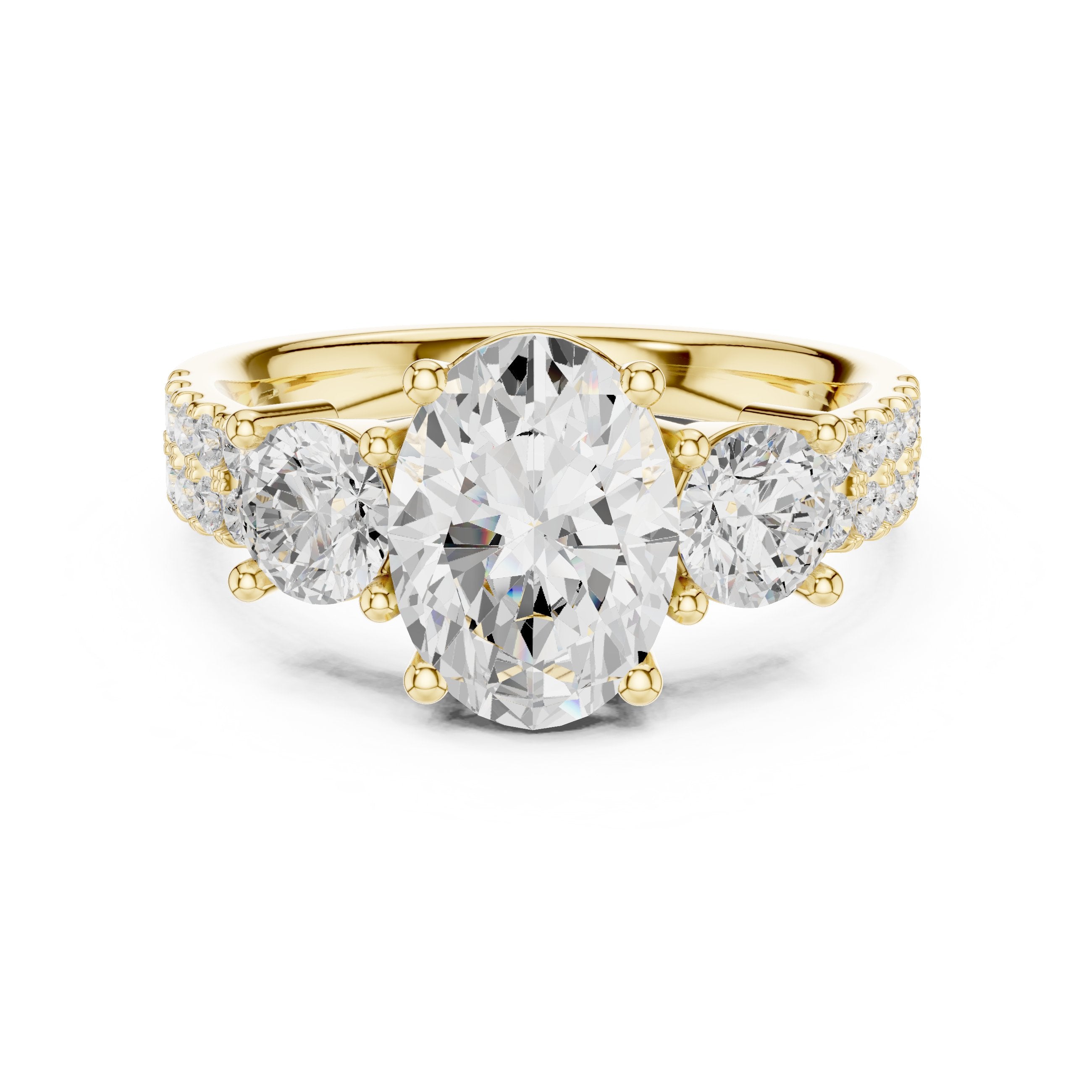 Oval Diamond Three Stone Engagement Ring with Round Sides and Pavé Band in Yellow Gold - VYKA Diamonds