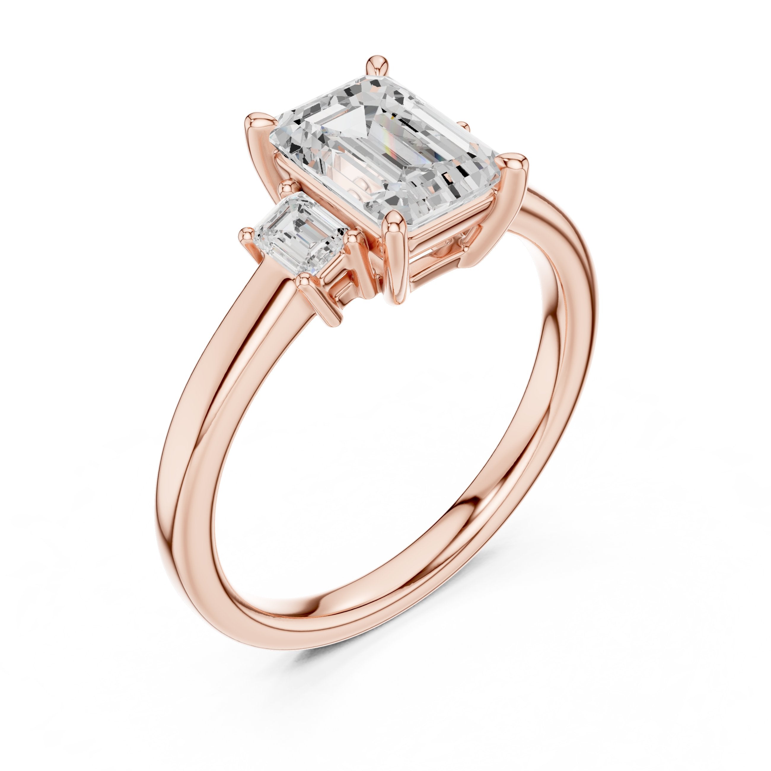 Emerald Cut Three Stone Engagement Ring in Rose Gold - VYKA Diamonds