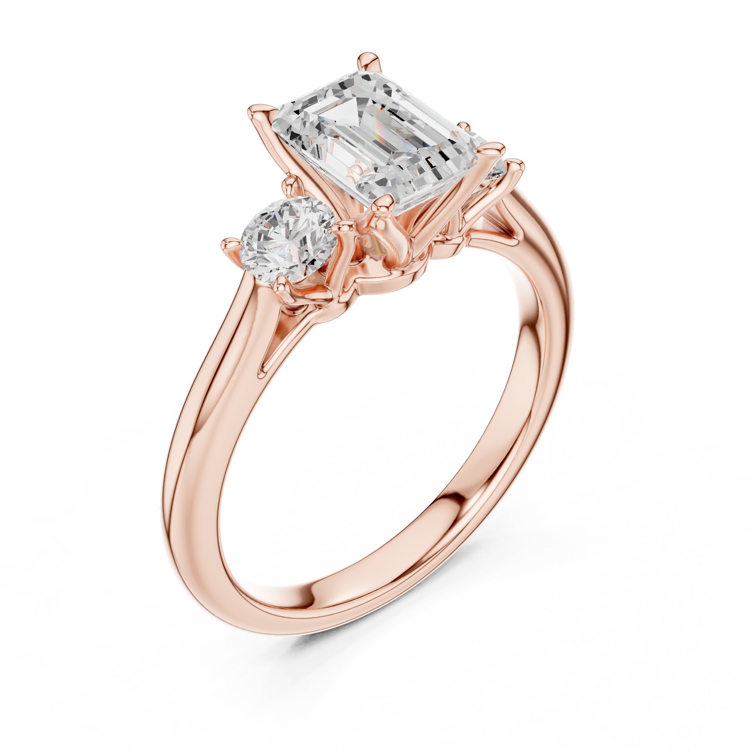 Emerald Cut Three Stone Engagement Ring with Round Sides in Rose Gold - VYKA Diamonds