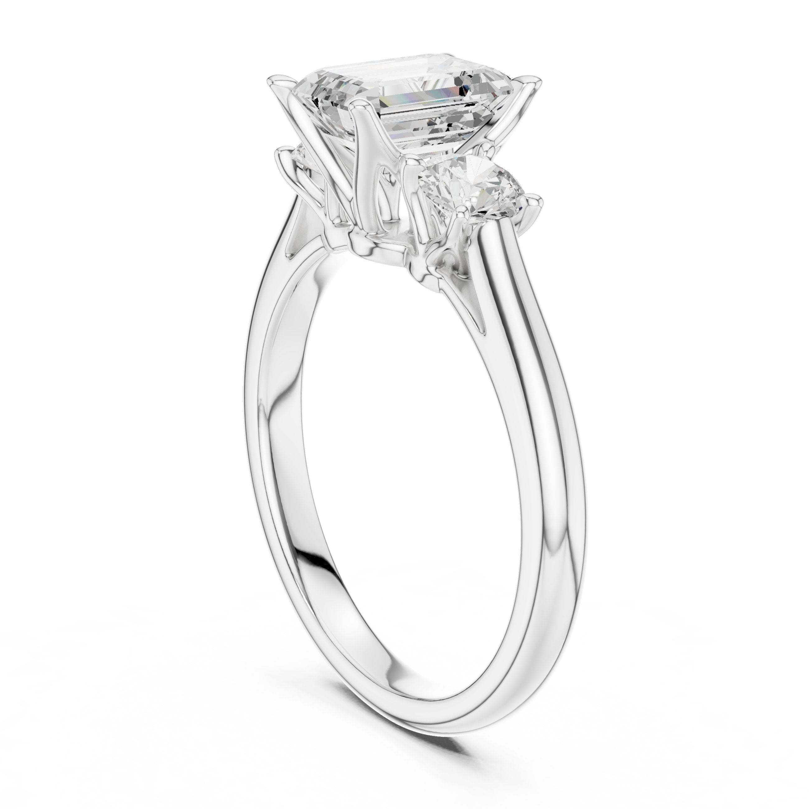 Emerald Cut Three Stone Engagement Ring with Round Sides in White Gold - VYKA Diamonds