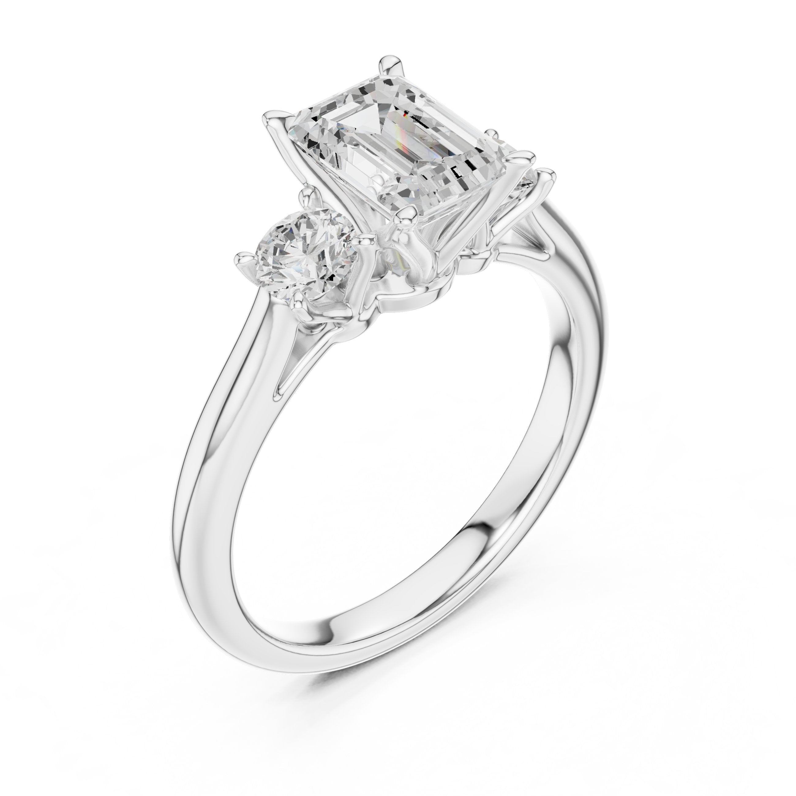 Emerald Cut Three Stone Engagement Ring with Round Sides in White Gold - VYKA Diamonds