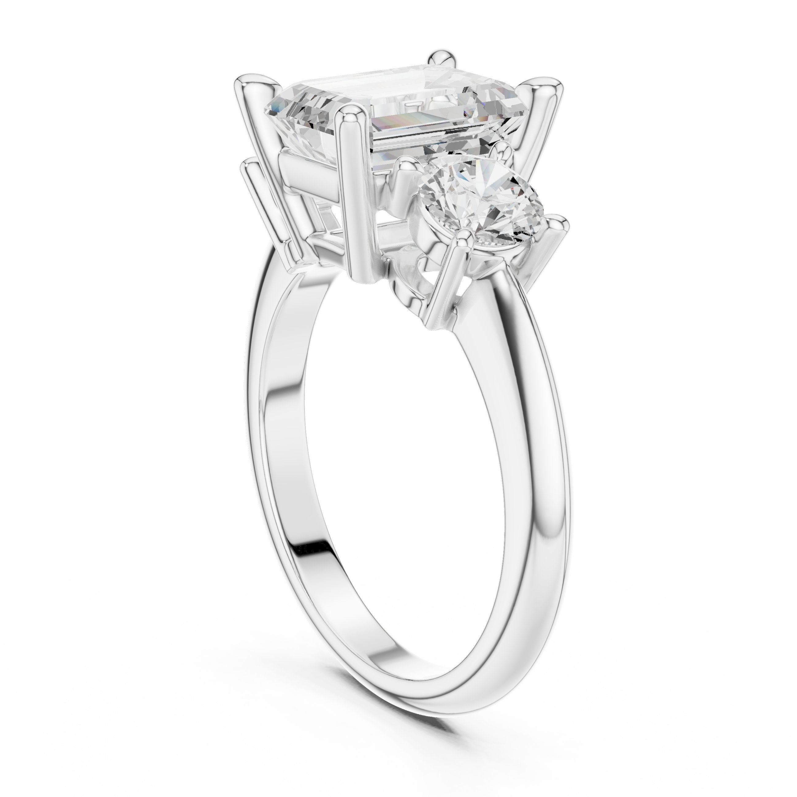 Emerald Cut Three Stone Engagement Ring with Round Sides in White Gold - VYKA Diamonds